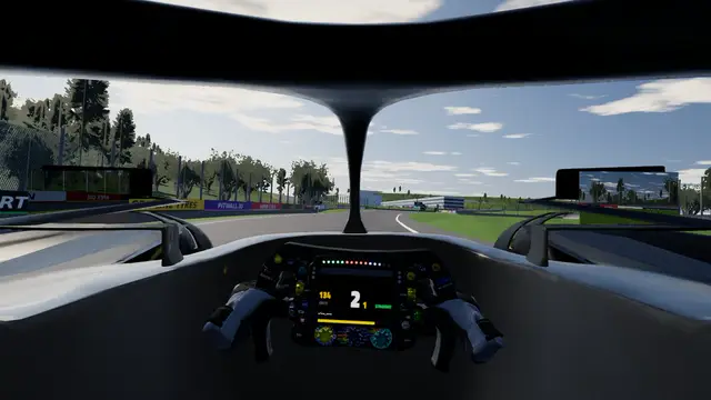 The 2026 cockpit at Spa with the gloves on the wheel and both mirrors