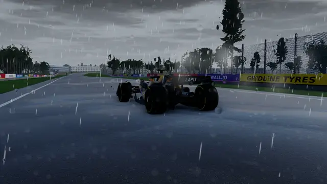 Racing in the rain at Silverstone, spray behind the cars